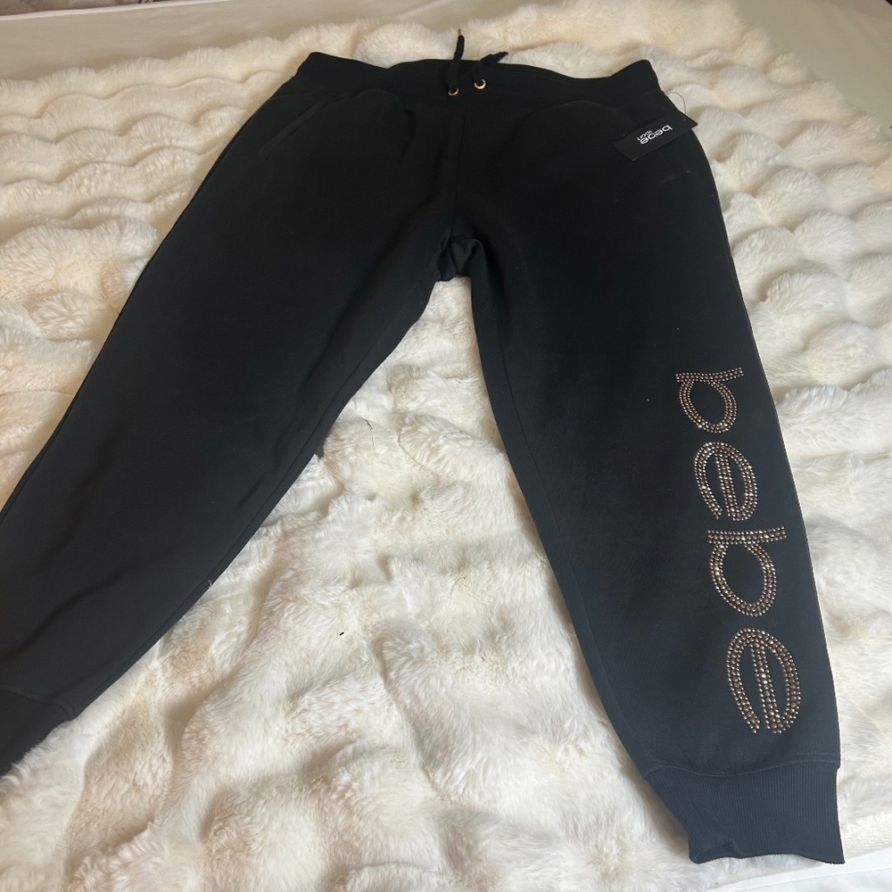 Bebe Women’s 2X Rhinestud Jogger, Black with Rose Gold studs